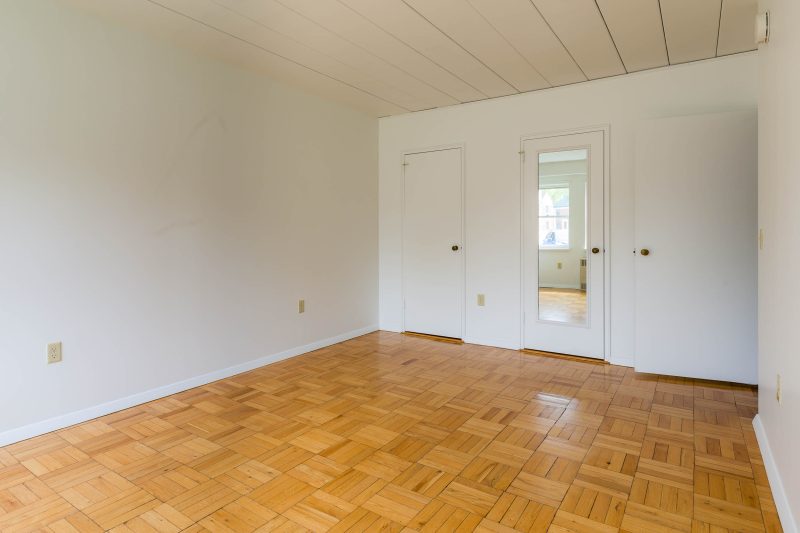 The bedroom in a 1 Bedroom University Houses apartment.
