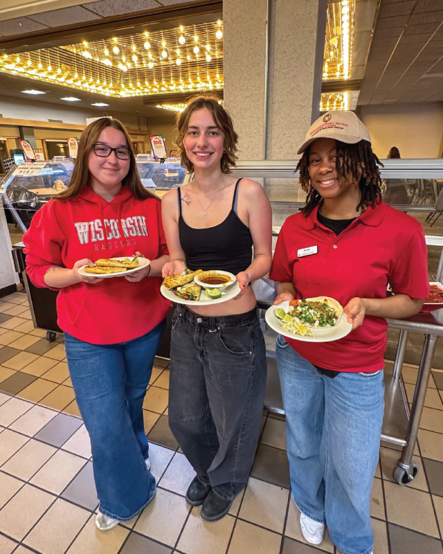 Students pose for photo at DavO Tacos event