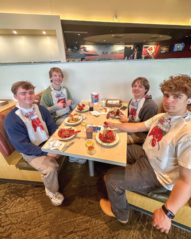 Housing Resident Appreciation Lobster Dinner - Students eating with bibs