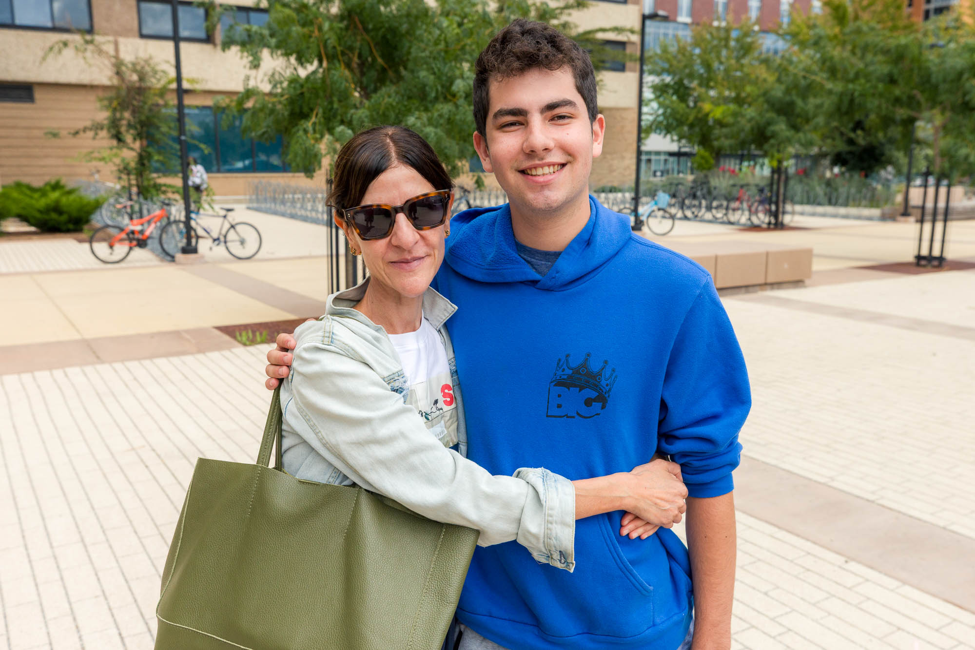 Two people hugging while posing for a photo