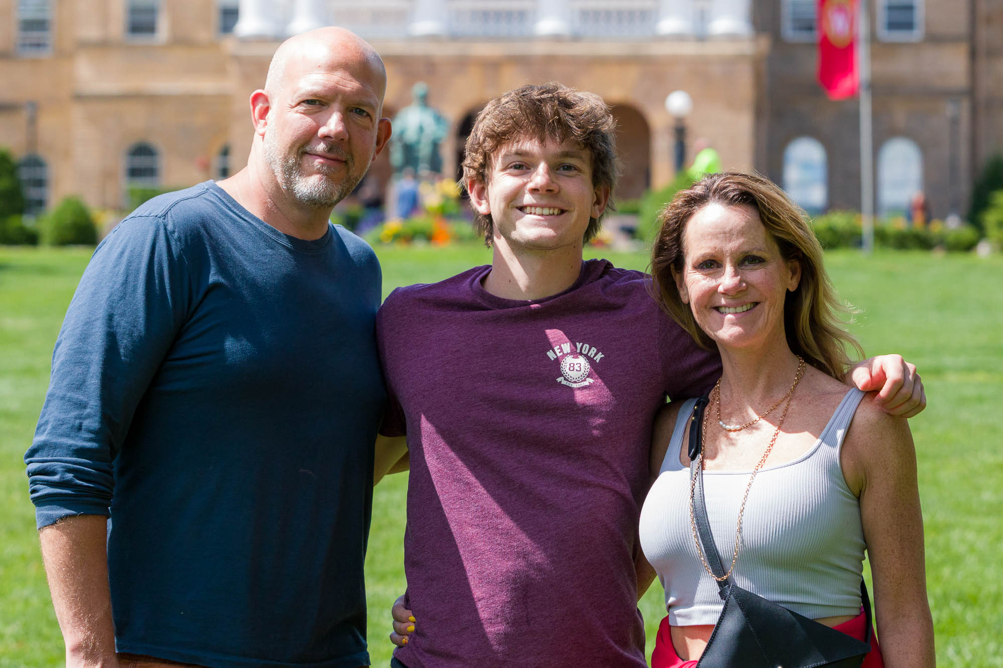 Three people pose for a photo