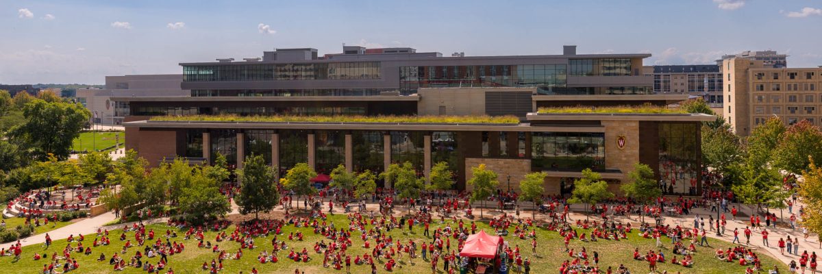 A large group of people in front of a building from a high angle