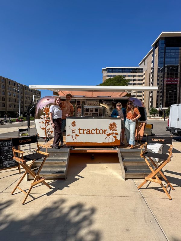 Tractor Beverage Pop Up Airstream with four staff members posing