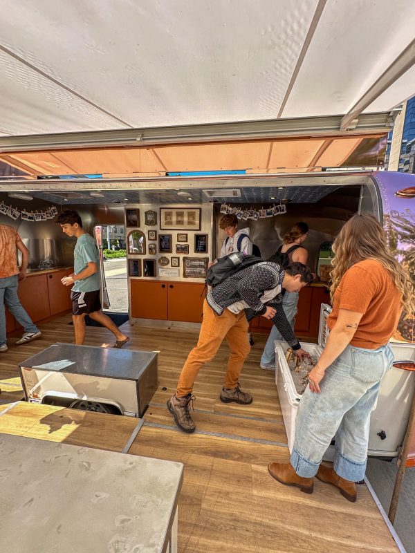 Tractor Beverage Pop Up Airstream with students exploring