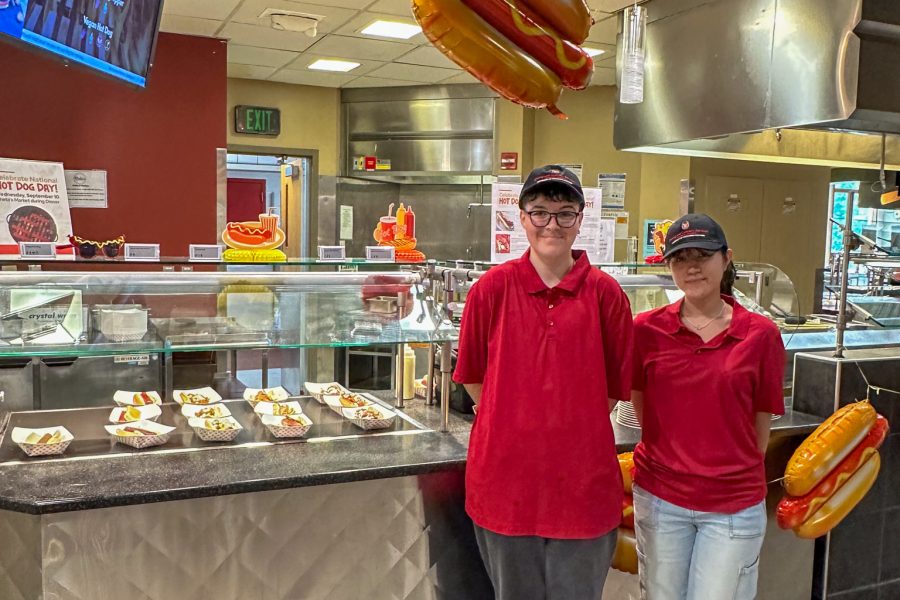 Dining staff pose for National Hot Dog Day
