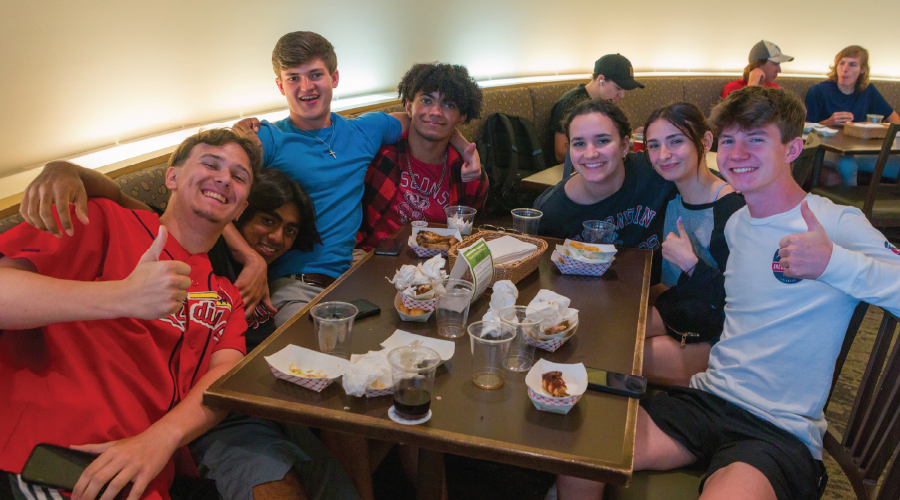 Students pose for photo in Four Lakes dining area
