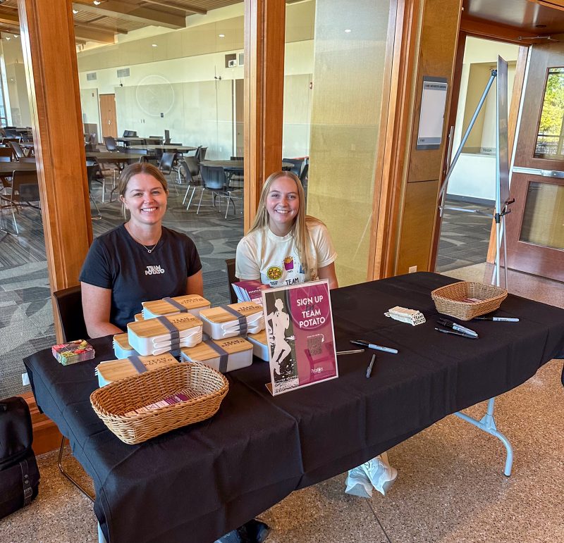 Team Potato Takeover Tabling Event with staff posing