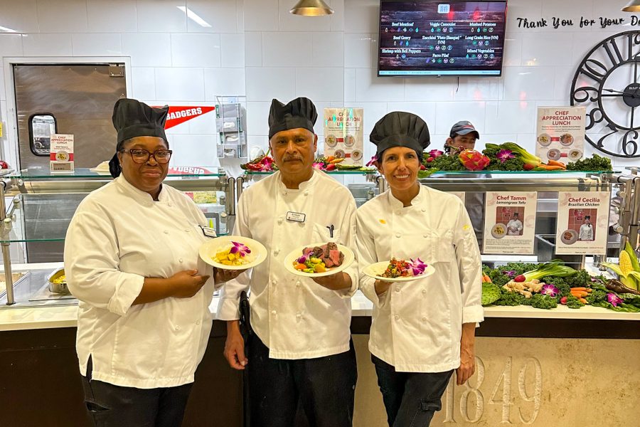 Three chefs posing with their special entree at their Chef Appreciation lunch in Gordon Avenue Market