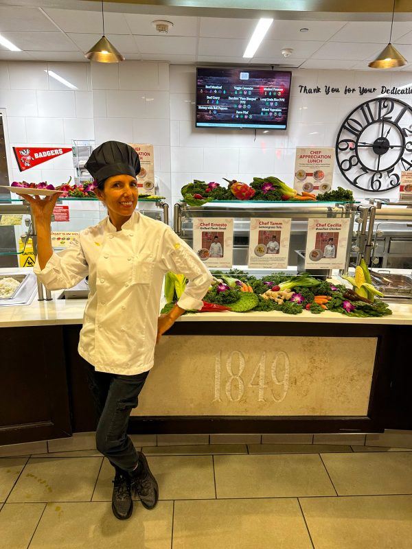 Chef Cecilia posing with her special entree at the Chef Appreciation lunch in Gordon Avenue Market