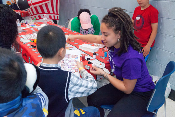 MLC residents volunteer in Eagle's Wing childcare center