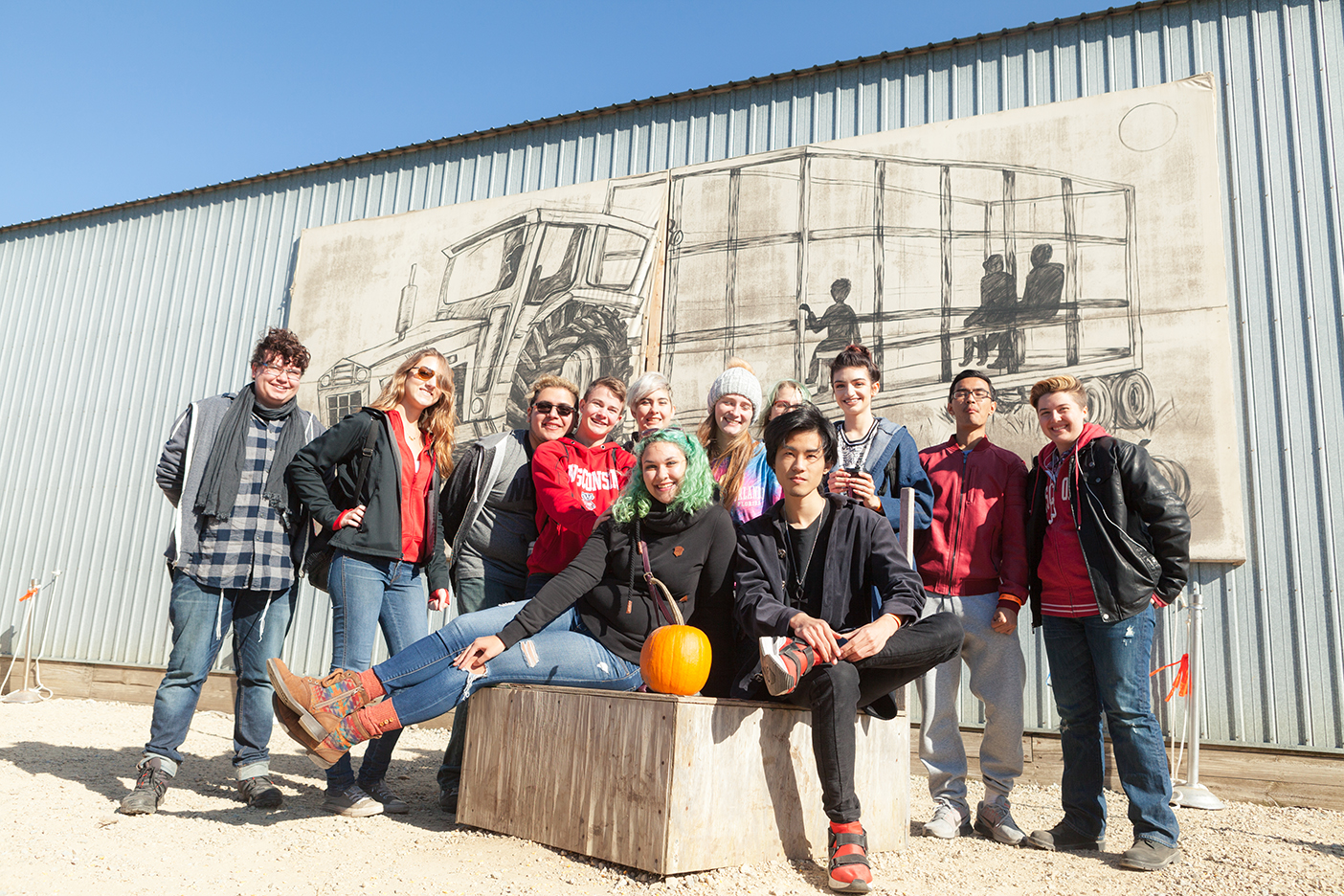 Open House residents pose for a picture at the pumpkin farm