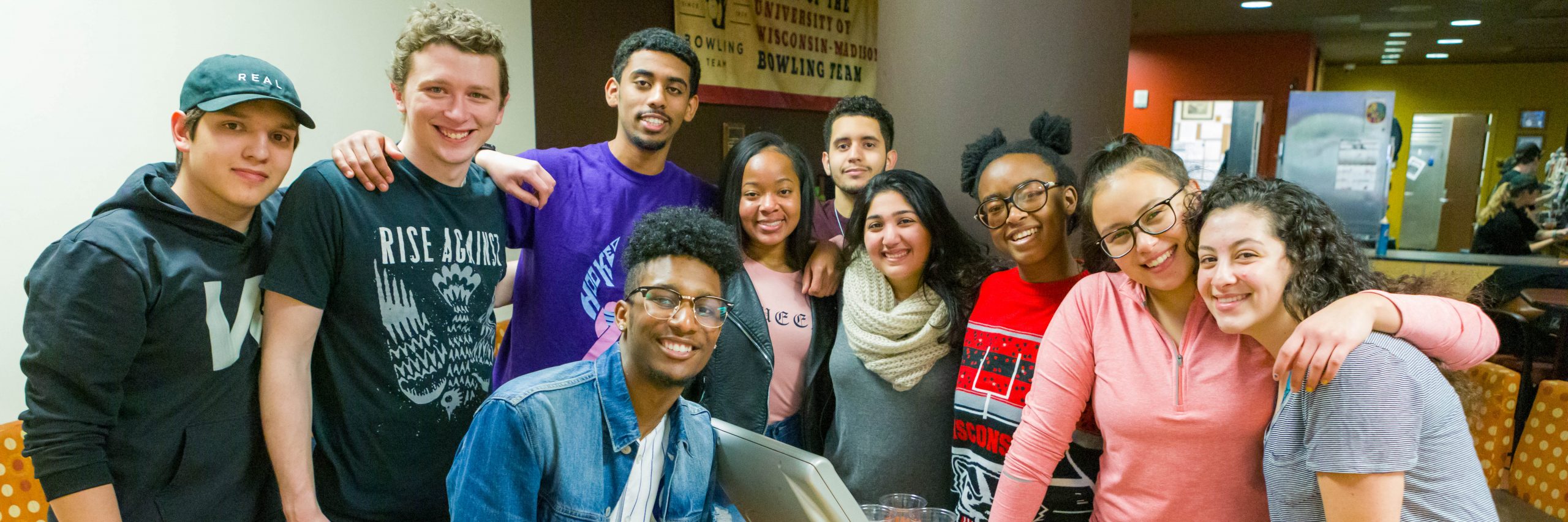 Students pose for a photo while bowling at Union South