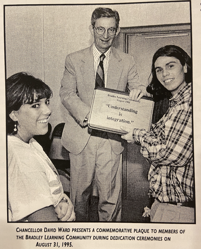Chancellor Ward presents a commemorative plaque to BLC