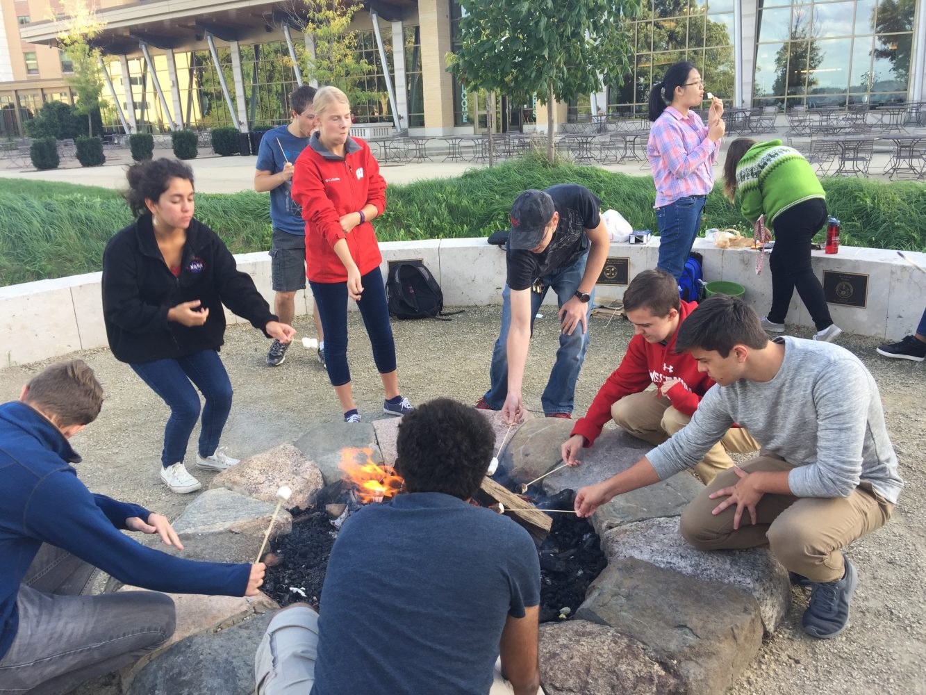 Residents making s'mores at the Dejope fire circle