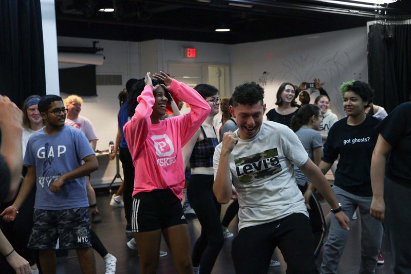 Residents of The Studio Learning Community dance during a seminar