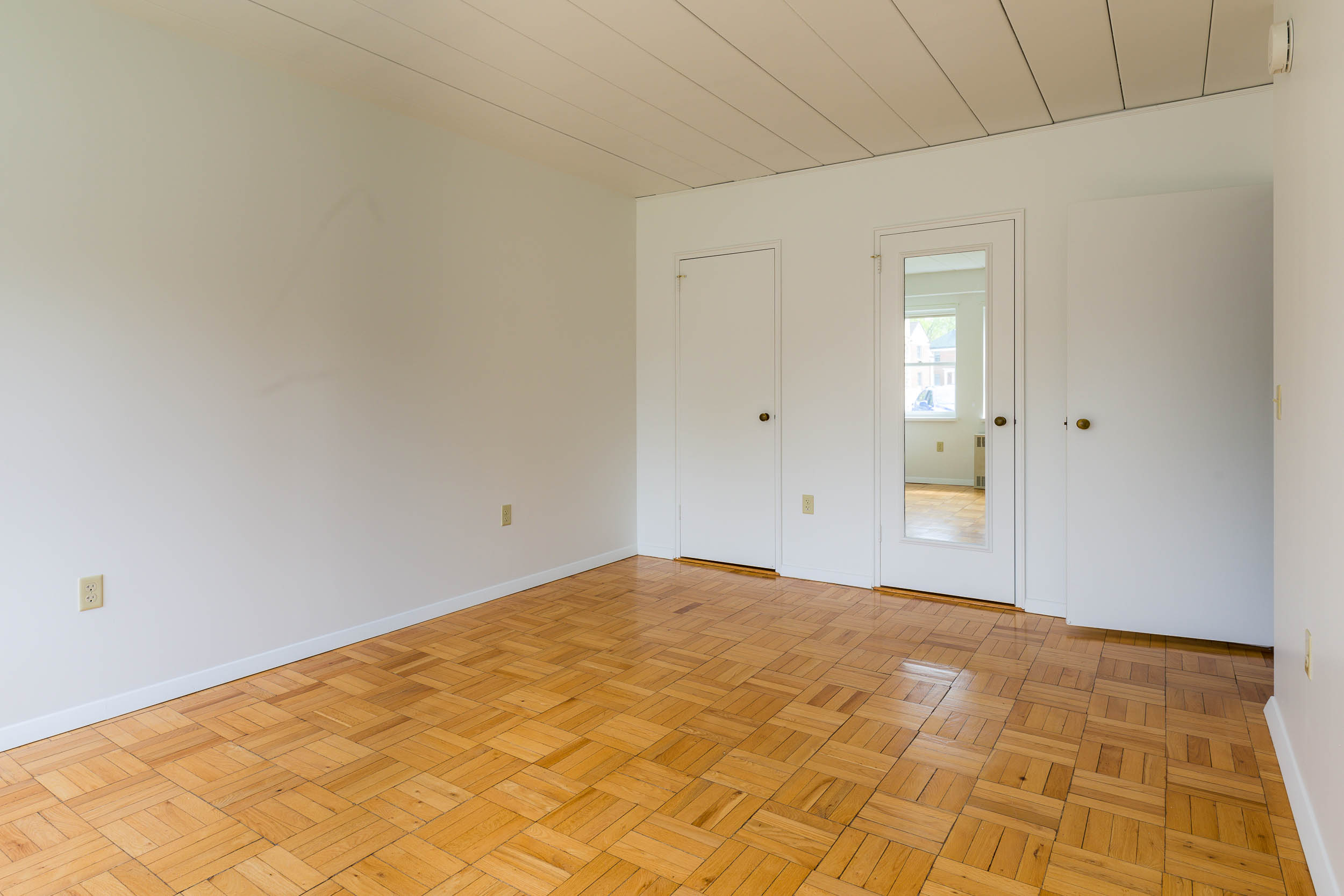 The bedroom in a 1 Bedroom University Houses apartment.