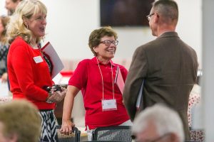 Chancellor Rebecca Blank speaks with colleagues at the Witte Residence Hall rededication event