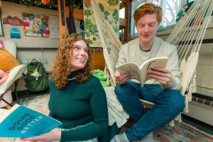 Winners of the 2023 Best Room Contest spend time with friends in their room in Cole Residence Hall