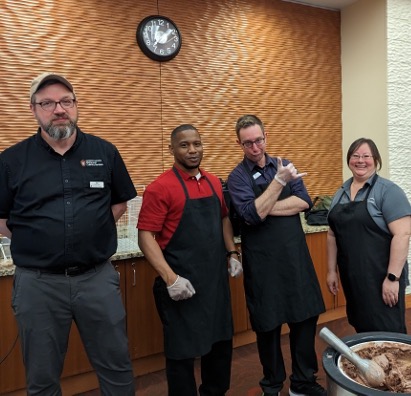 Four Dining staff pose for a group photo at Gordon