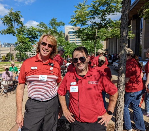 Two Four Lakes staff pose for a photo on the Gordon lawn