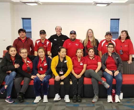 The Merit, Ogg, Davis, and Smith Custodial team posing for a group photo