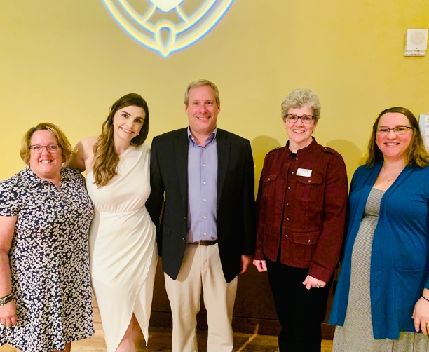 Staff posing for a group photo at the Partners in Giving award ceremony