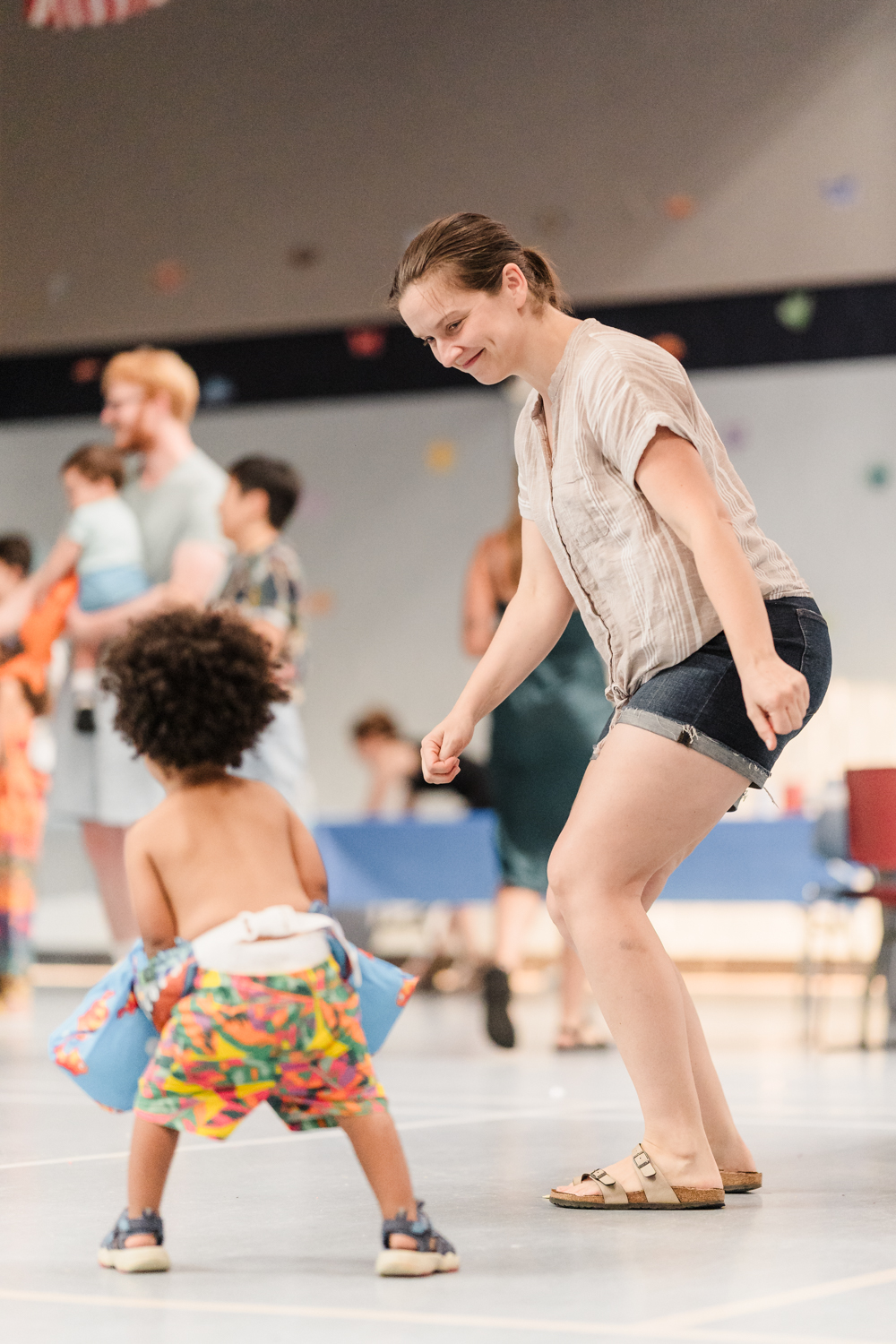 An adult and a child dancing