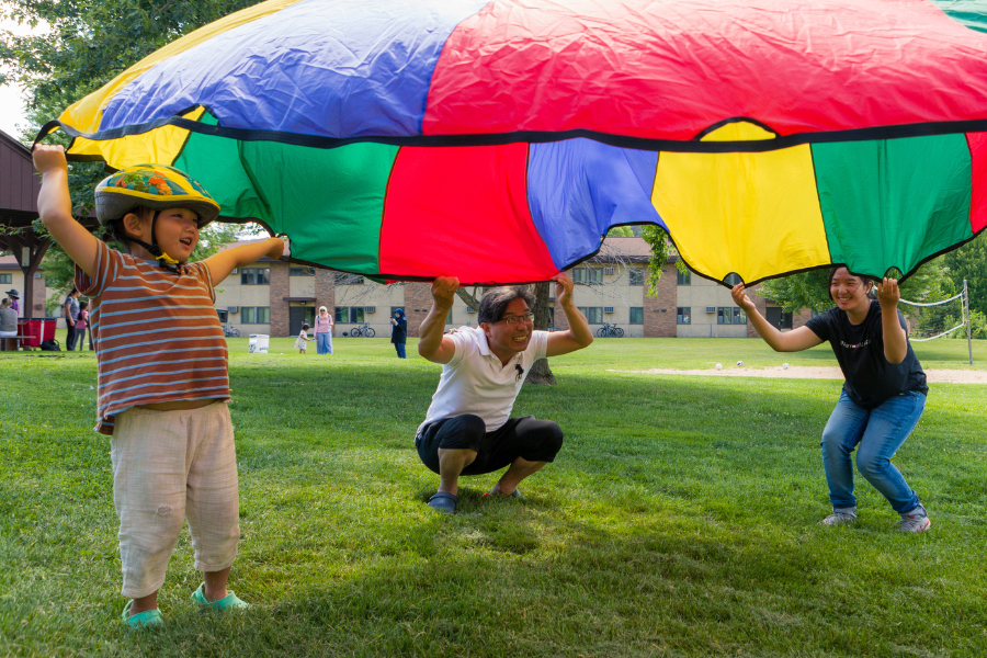 UA family playing outside at community event