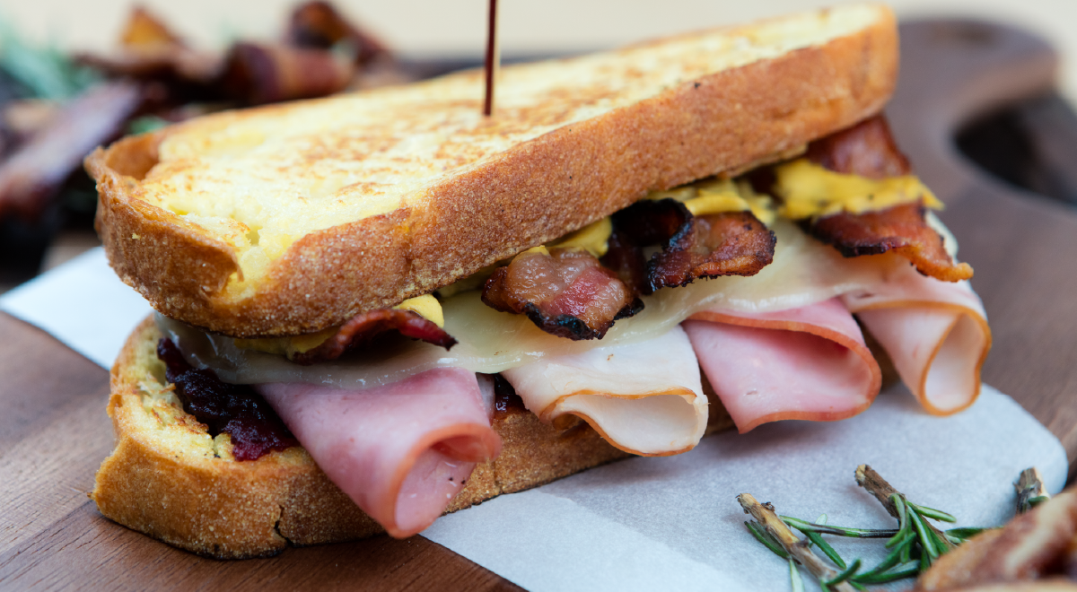 bacon, ham, turkey, and provolone sandwich