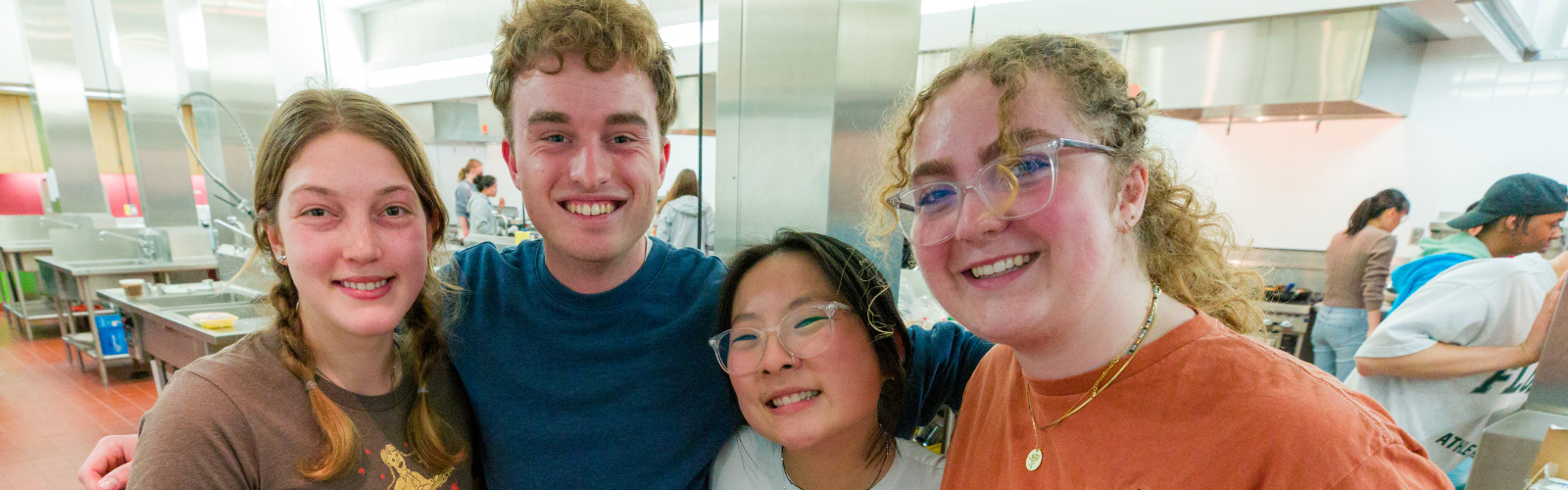 Students in the Greenhouse Community cooking.