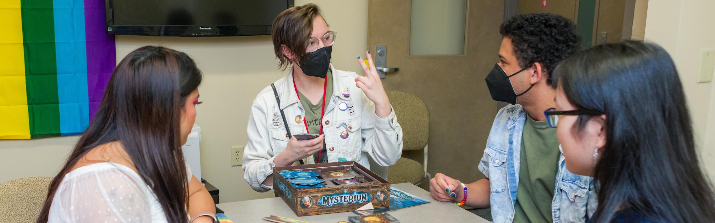 Students playing a game in a Merit lounge