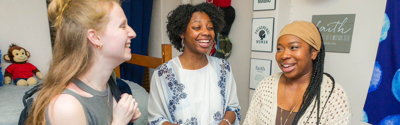 Residents laugh in a room in Barnard Residence Hall.