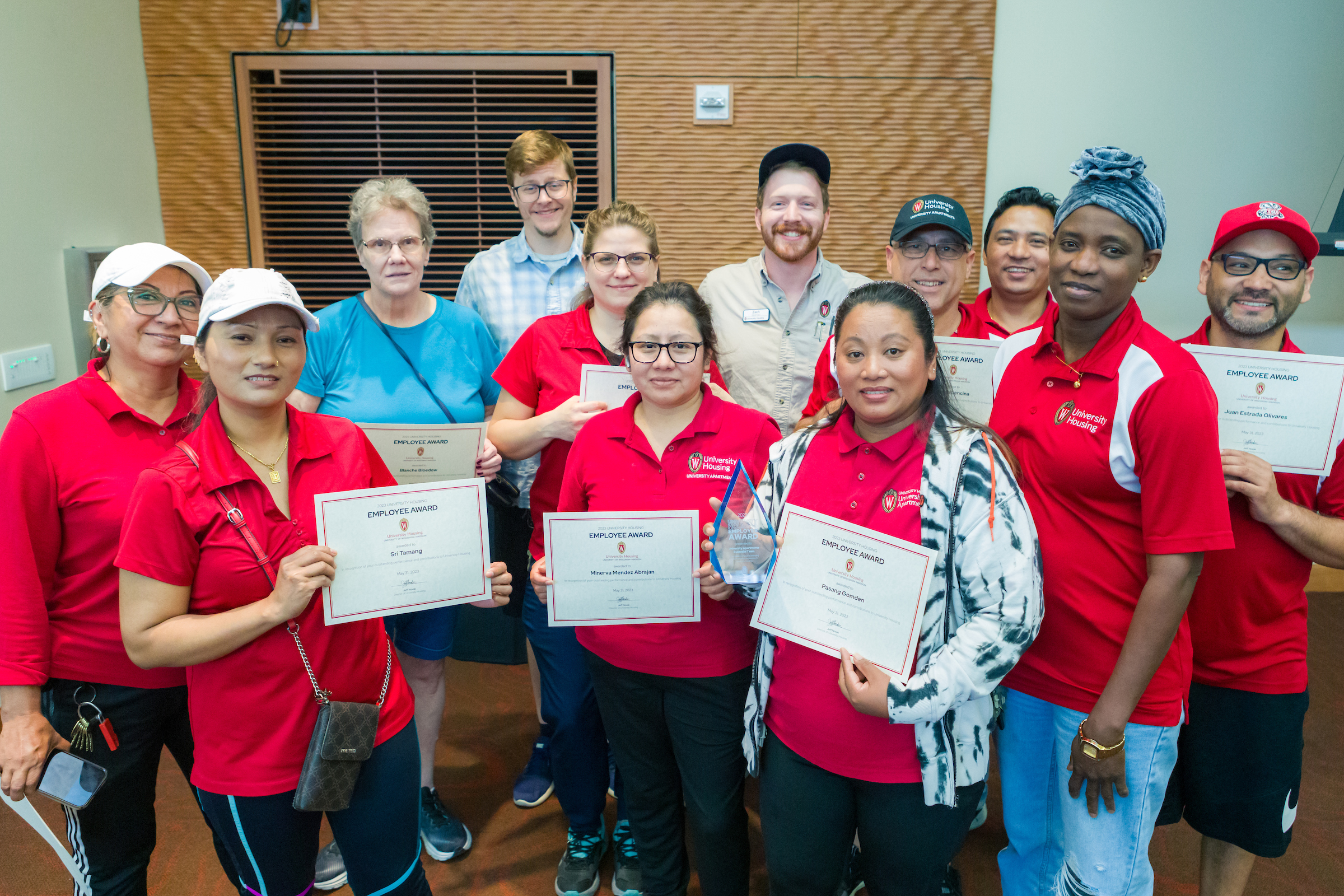 The UA Custodial team holding their 2023 Employee Awards