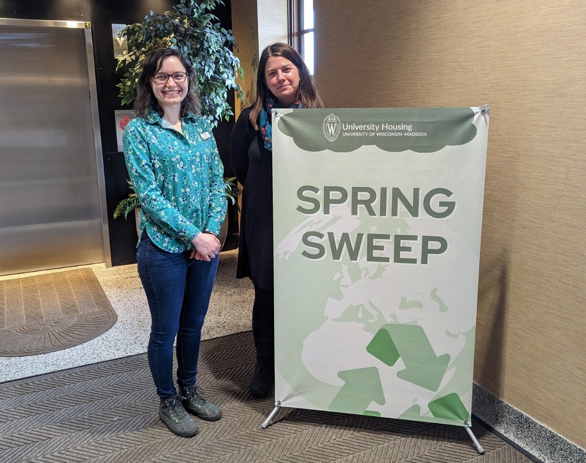 Two staff pose for a photo at the Spring Sweep
