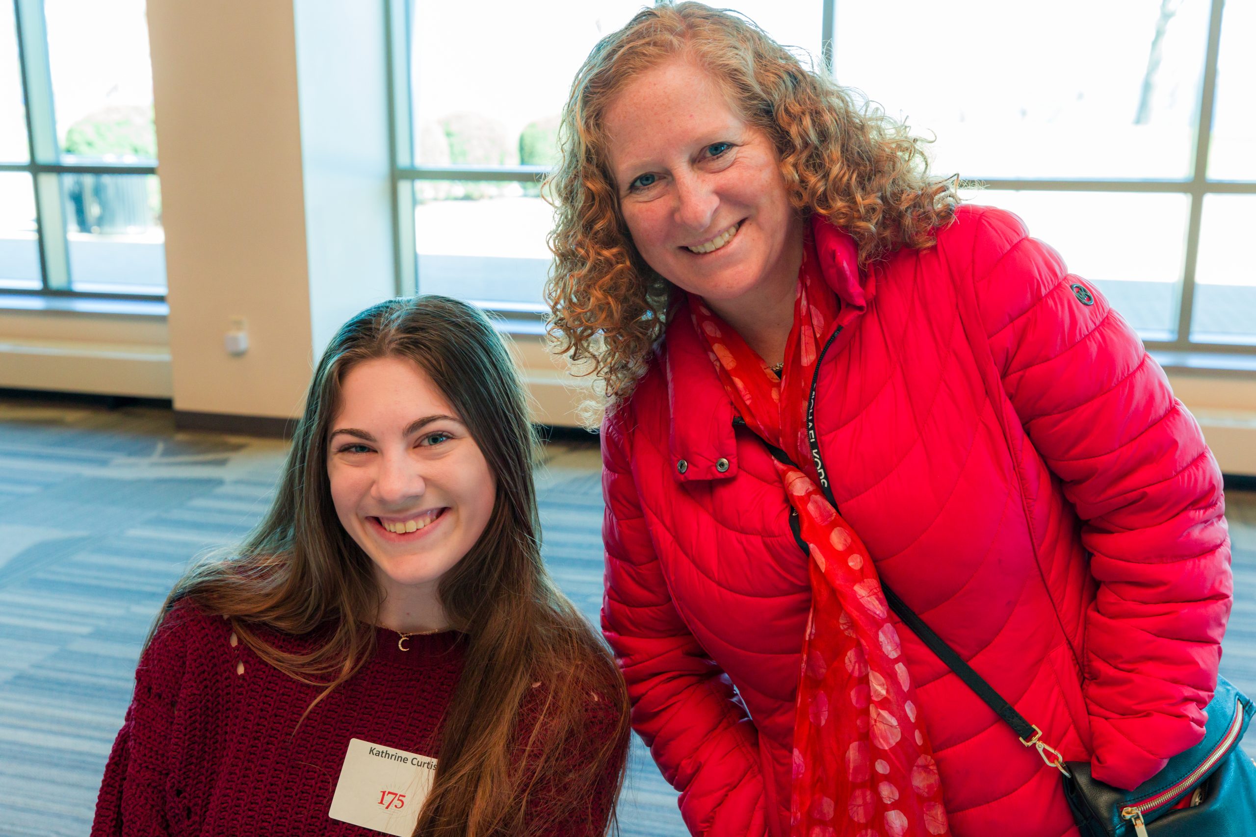 Chancellor Mnookin posing with a student for a photo