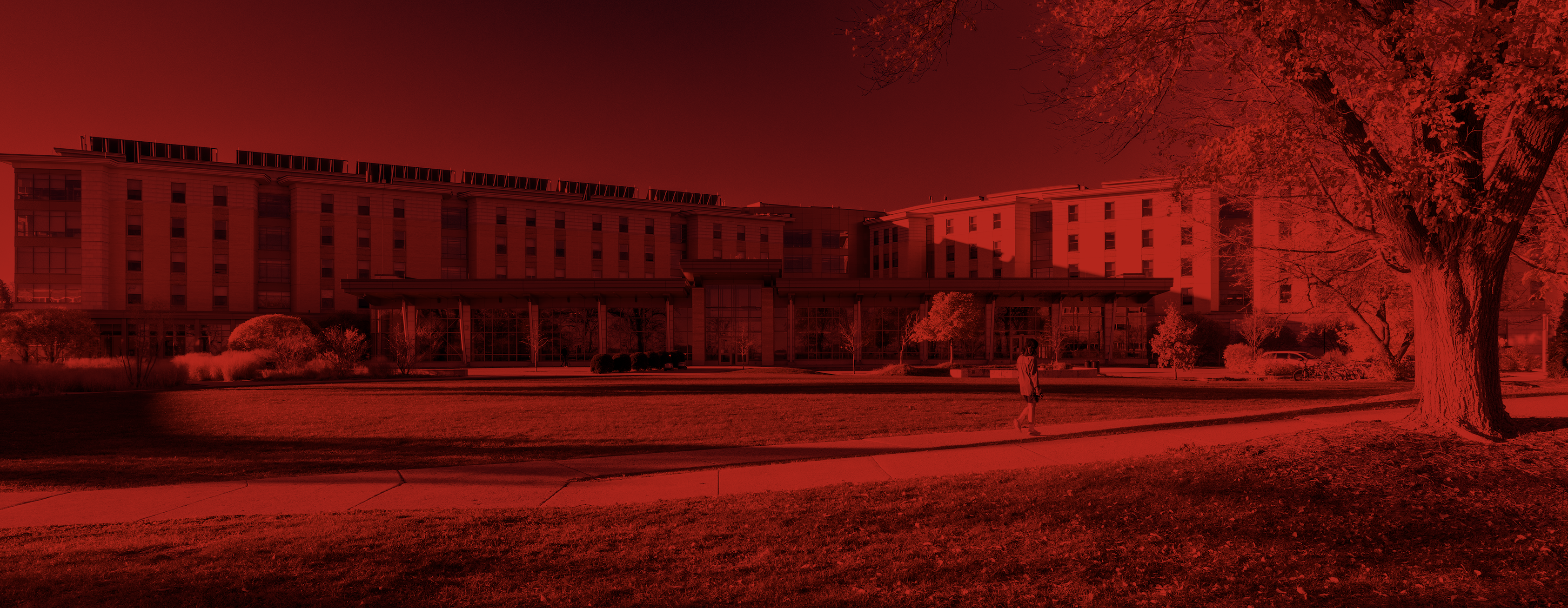 Exterior photo of Dejope Residence Hall and Four Lakes Market with a red overlay