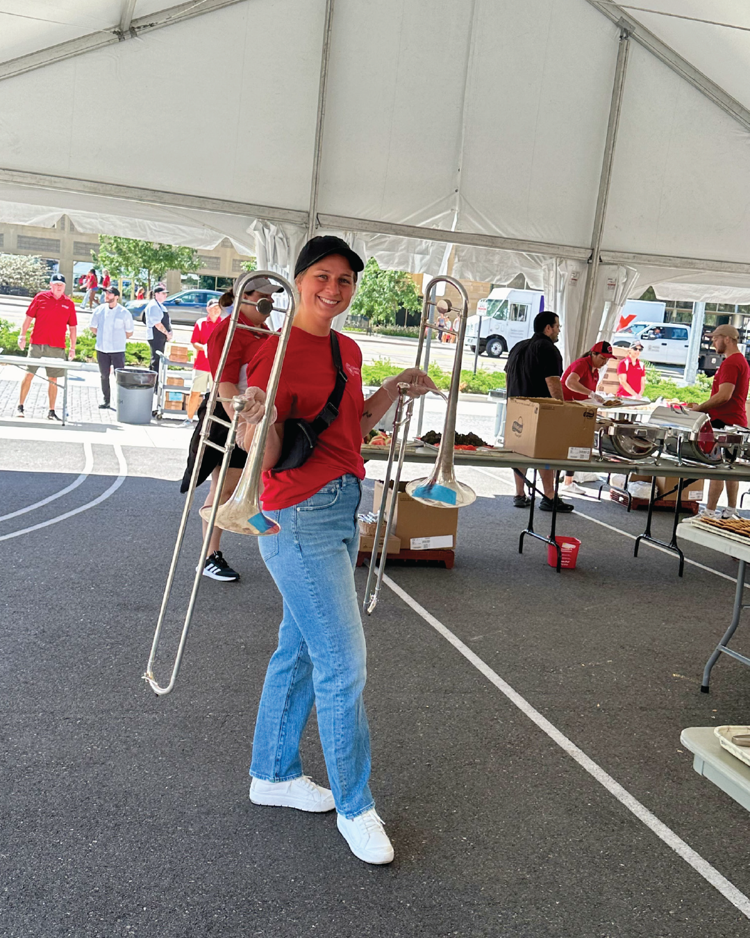 Housing staff holding band members instruments while they get food