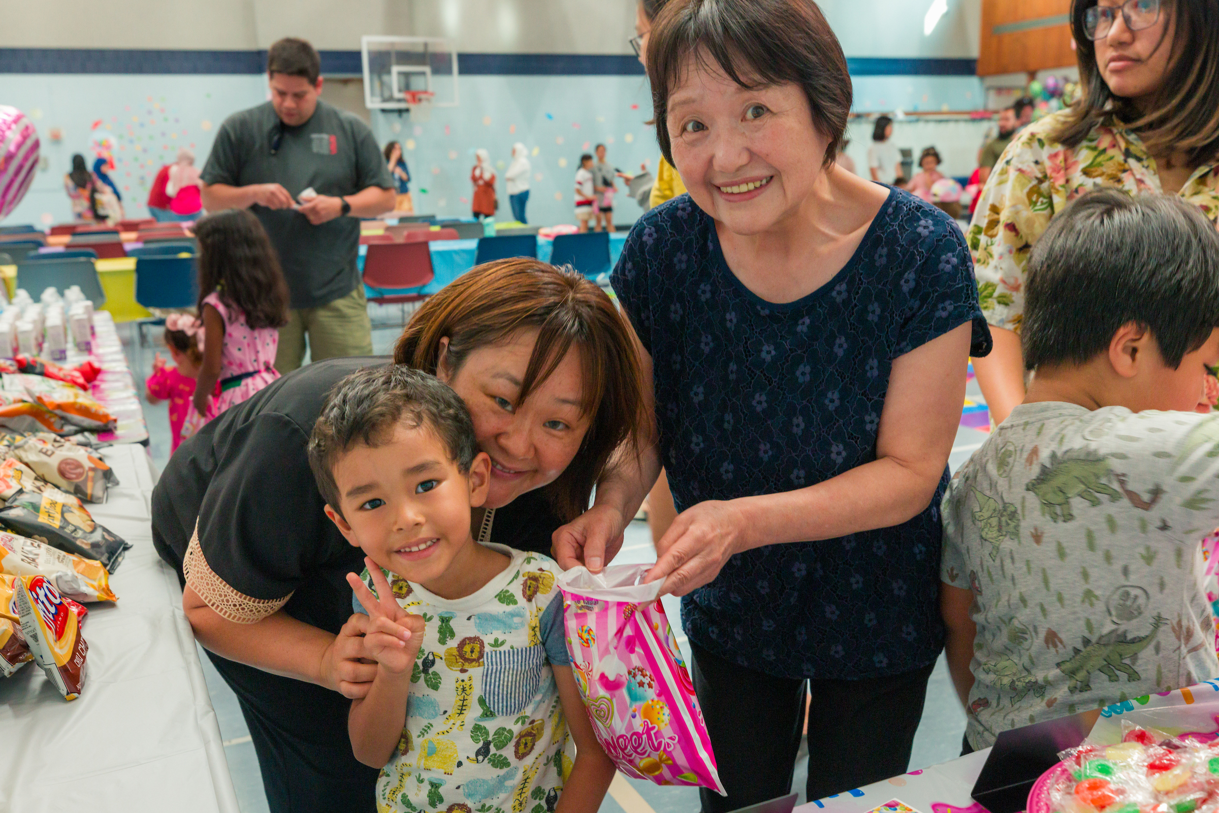 Family getting candy at UA prom event
