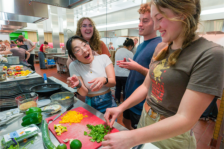 Students cooking with food created in Greenhouse LC