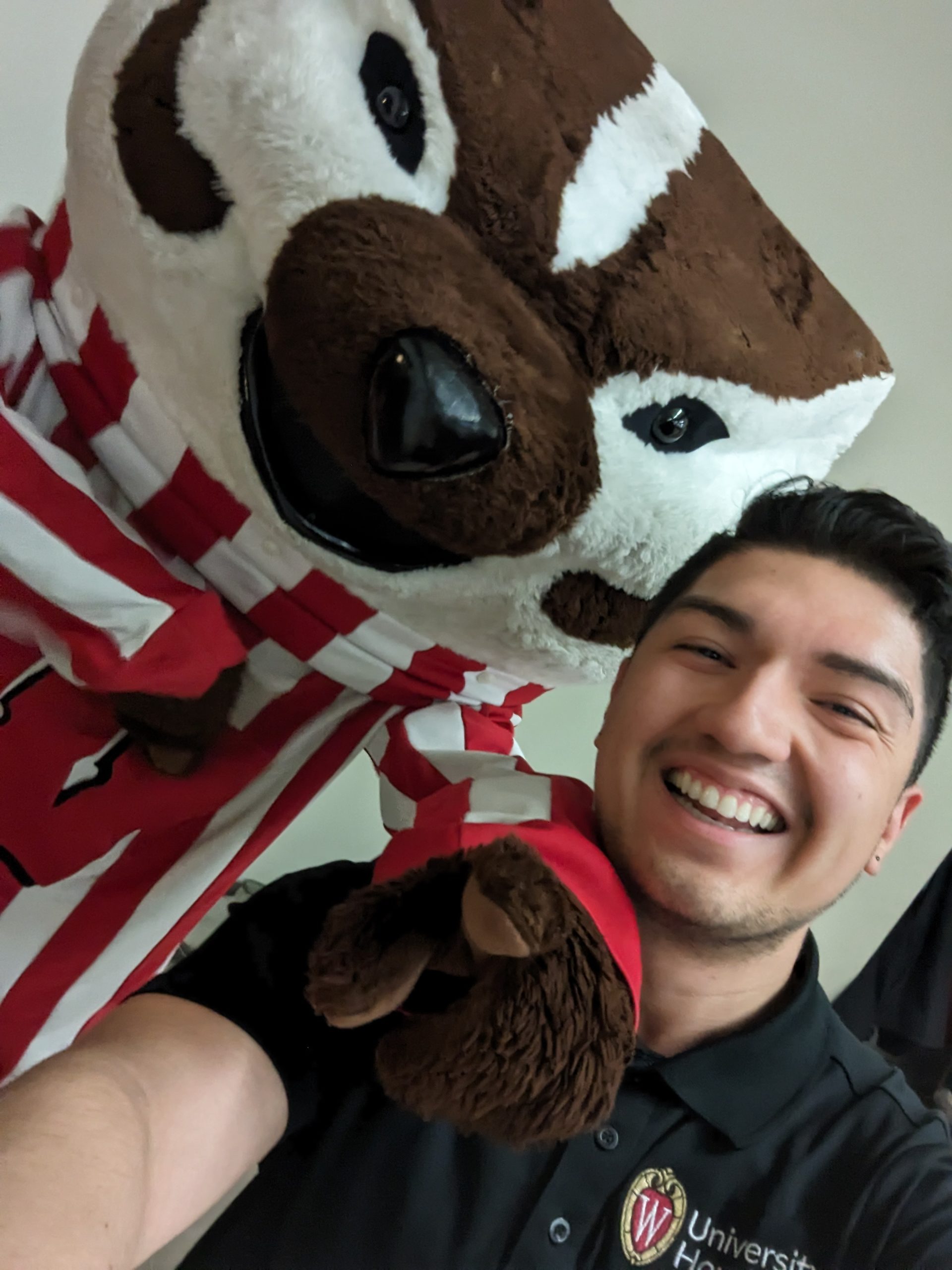 Man smiling with Bucky in a selfie
