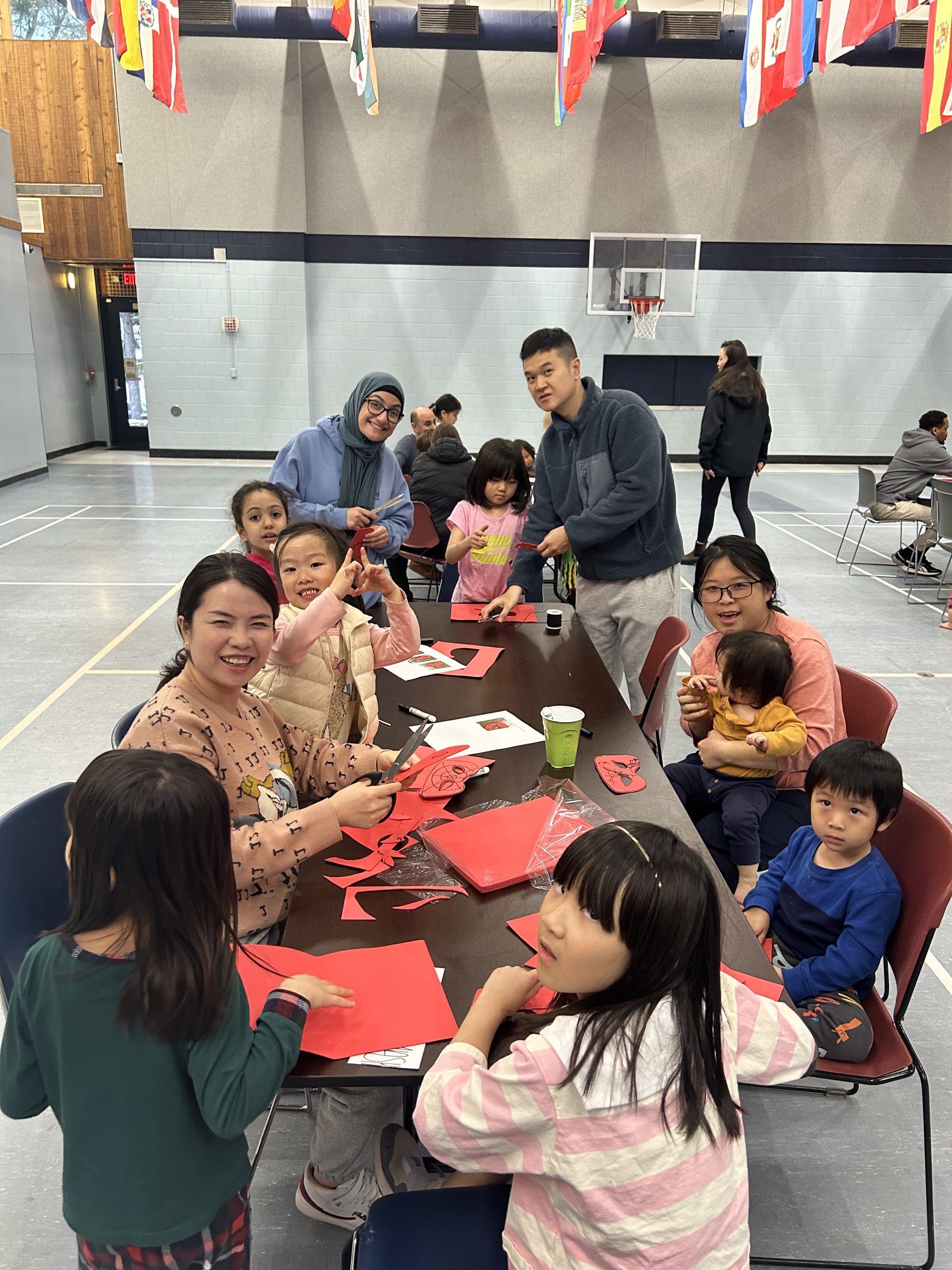 Group of people making homemade spiderman masks