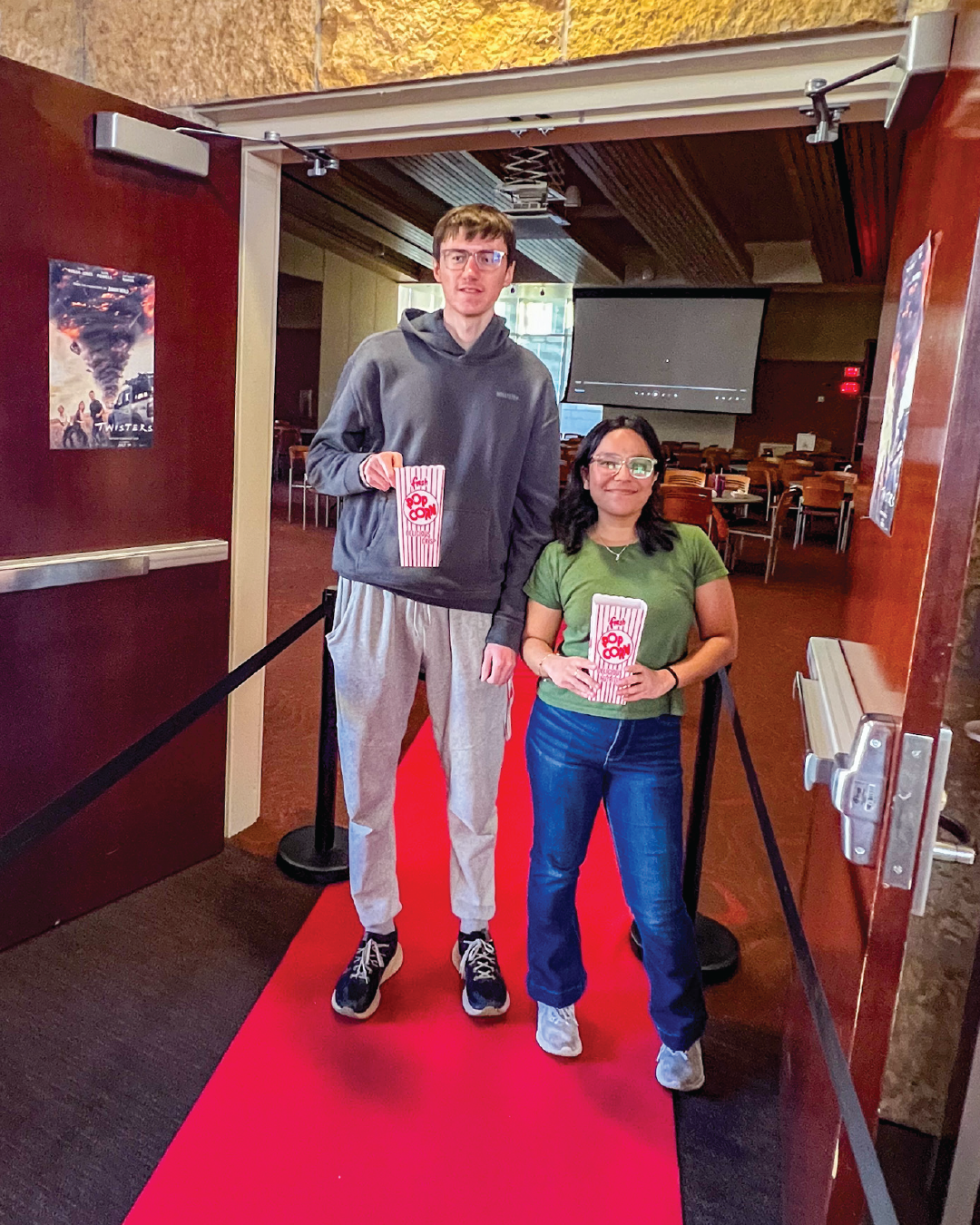 Students posing on red carpet at Dinner and a Movie event Gordon