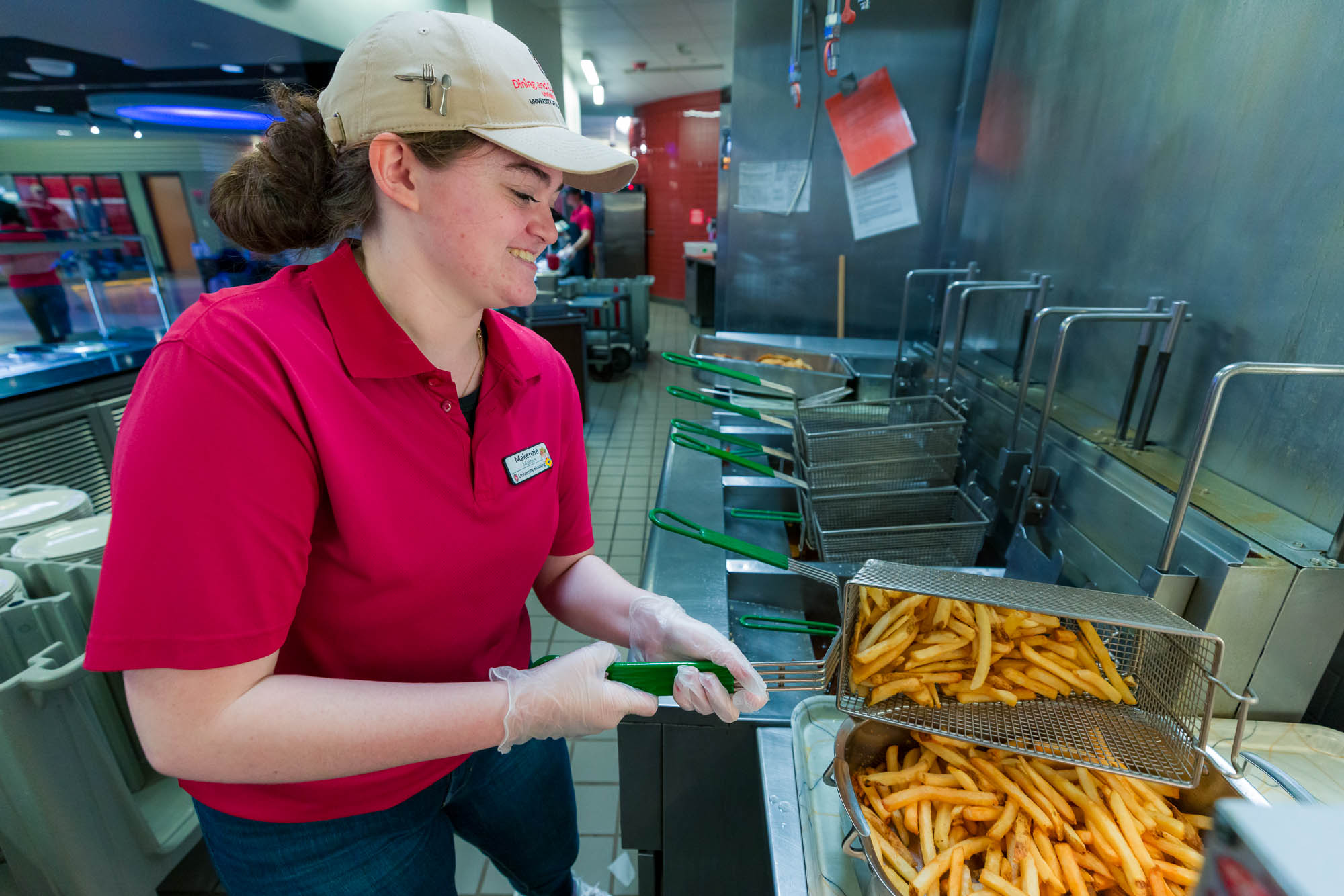 Makenzie Mathys prepares fries in Four Lakes Market.
