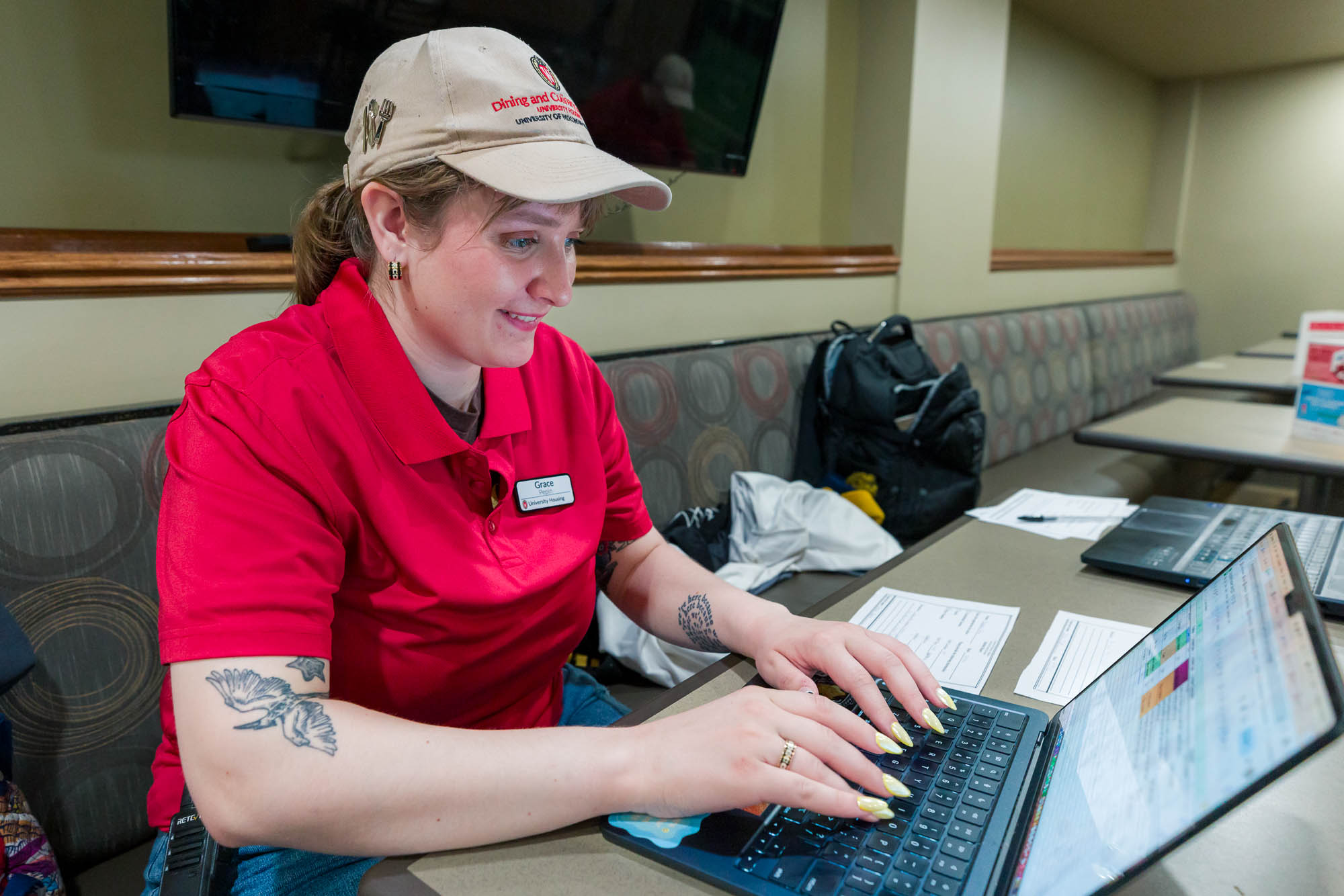 Grace Pepin works on her laptop in the Liz's Market dining room.