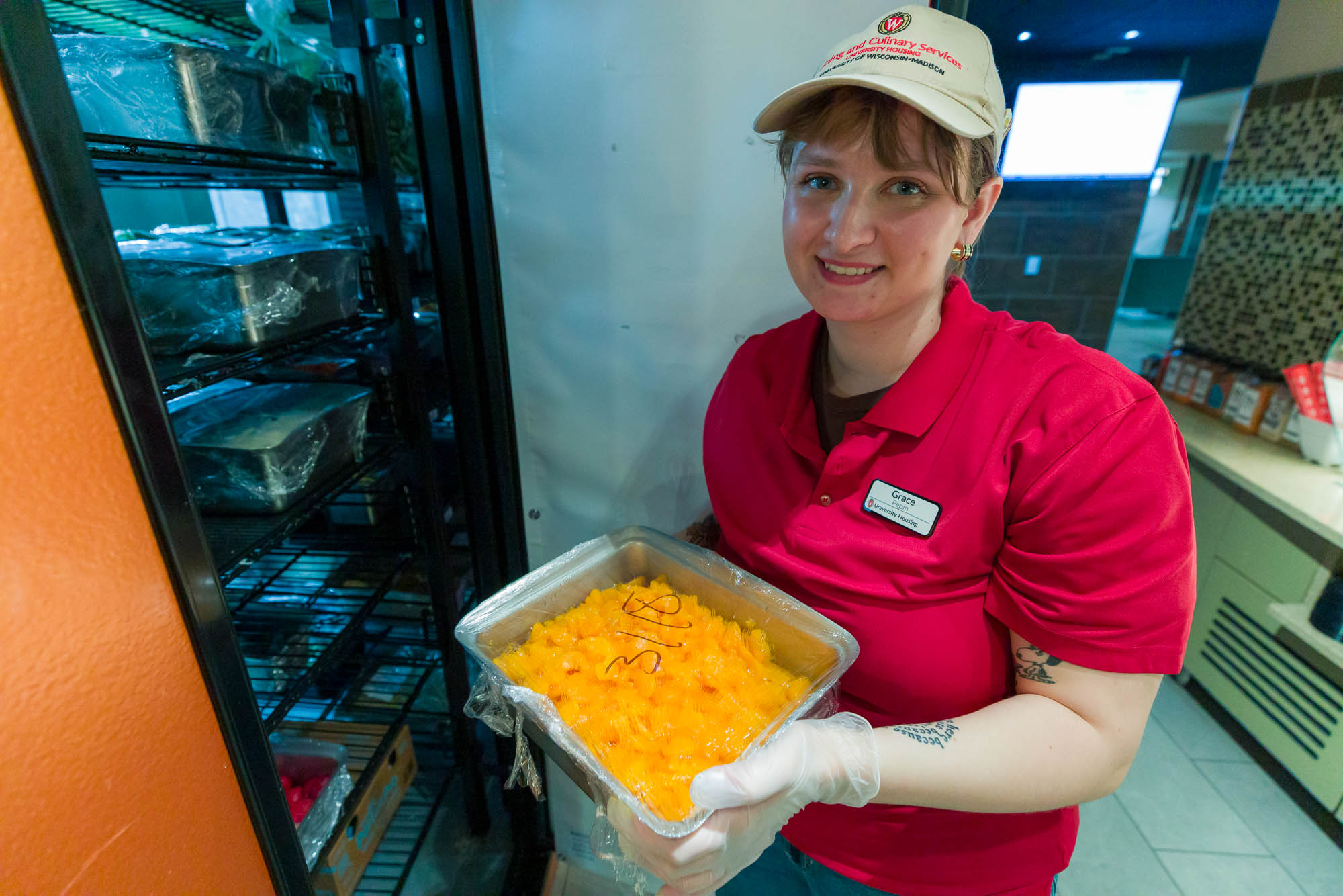 Grace Pepin removes fruit from a refrigerator in Liz's Market.