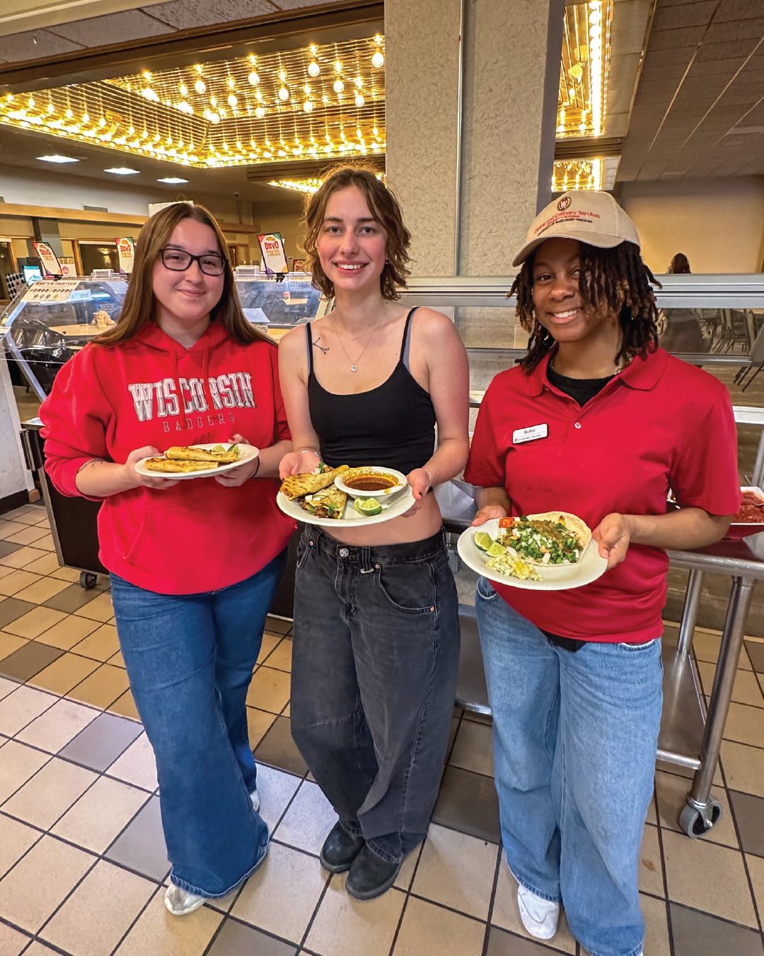 Students pose for photo at DavO Tacos event