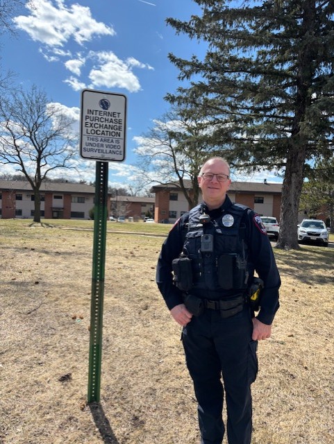 Police Officer Kirchaman standing outside by the IPEL sign