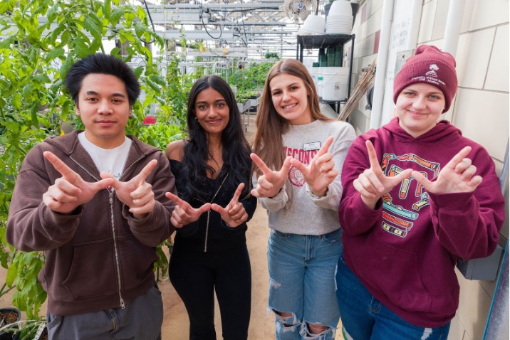 Resident Sustainability Ambassador Program (RSA) students posing in the green house