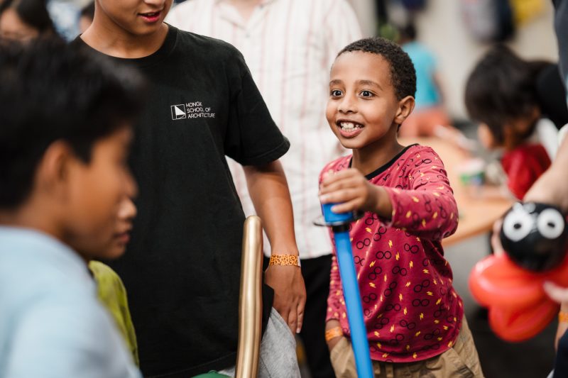 Young boy smiling and playing