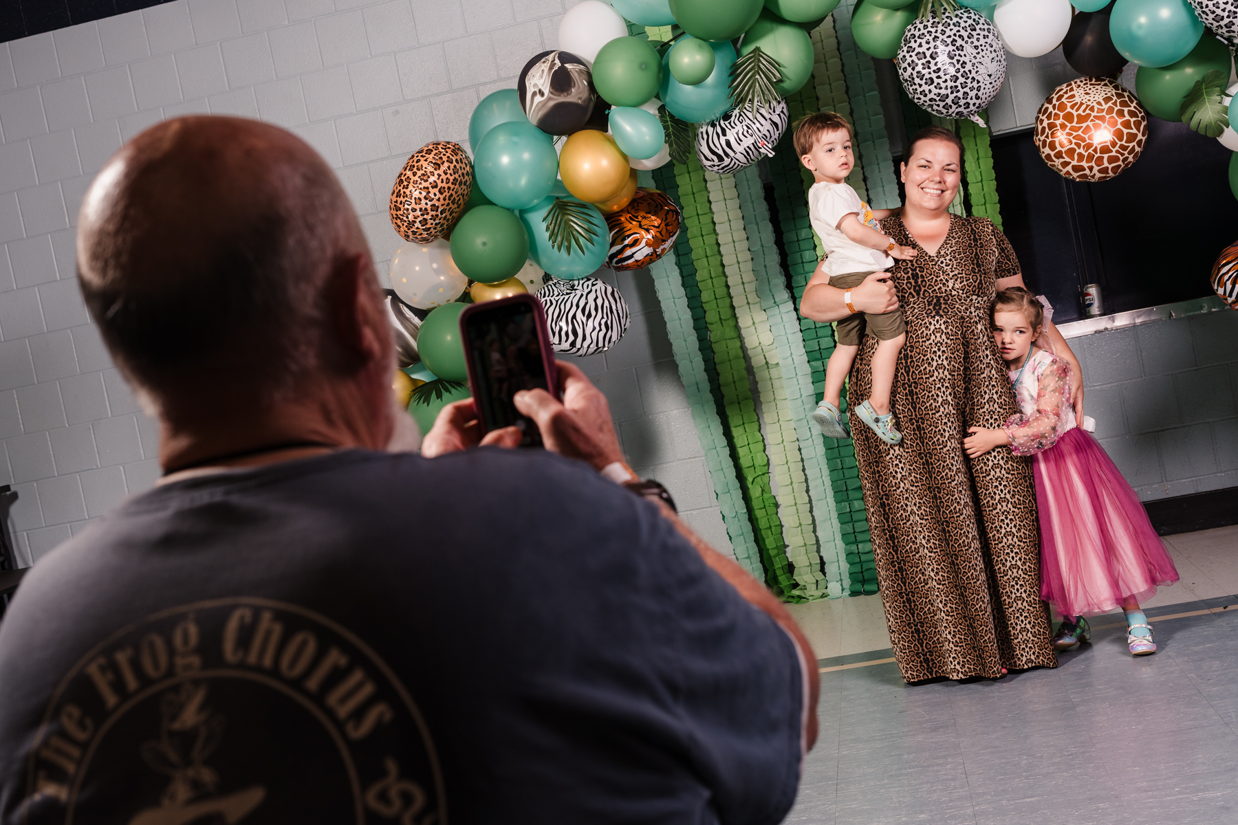 Women with two kids getting photo taken